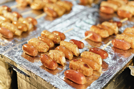Exotic rolls with sausage at Myeongdong open street market in Seoul, South Koreaの写真素材