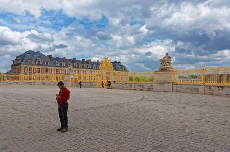 Paris, France - May 5, 2012: Golden Gate of Honor in Palace of Versailles in Paris in France. Tourist on the background.のeditorial素材