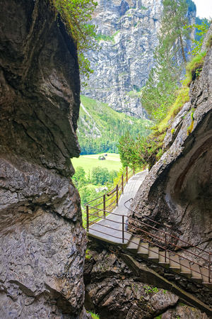 Gorge with stairs in Trummelbach falls, waterfall in the mountain in Lauterbrunnen valley, District of Interlaken, Bern canton in Switzerland.のeditorial素材