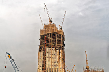 Modern Skyscrapers, cranes and construction in process in Kowloon in Hong Kong