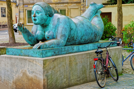 Bamberg, Germany - May 9, 2013: Lady with a fruit sculpture in the city center of Bamberg in Upper Franconia, Bavaria, Germany.のeditorial素材