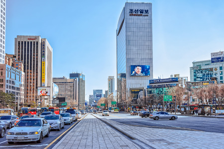 Seoul, South Korea - March 11, 2016: Much traffic and Modern skyscrapers in Jung district in Seoul, South Korea. People on the backgroundのeditorial素材