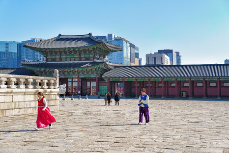 Seoul, South Korea - March 11, 2016: People in traditional costume at Third Inner Gate of Gyeongbokgung Palace in Seoul, South Koreaのeditorial素材
