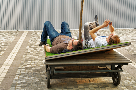 Hong Kong, Hong Kong - March 6, 2016: People relaxing in the bed in the strret of Kowloon in Hong Kongのeditorial素材