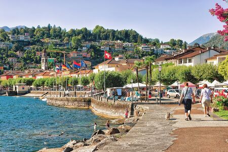 Ascona, Switzerland - August 23, 2016: People passing by at the promenade at the luxurious resort in Ascona on Lake Maggiore in Ticino canton in Switzerland.のeditorial素材