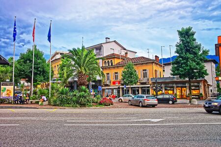 Locarno, Switzerland - August 25, 2013: Piazza Stazione in the city center of luxurious resort Locarno of Ticino canton, Switzerland. People on the backgroundのeditorial素材