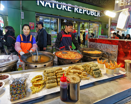 Seoul, South Korea - March 14, 2016: Sellers of Seafood at Myeongdong open street market in Seoul, South Korea. Selective focusのeditorial素材
