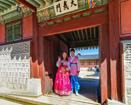 Seoul, South Korea - March 11, 2016: Young people in traditional costumes at Gyeongbokgung Palace in...