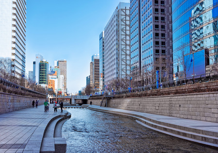 Seoul, South Korea - March 11, 2016: Urban park at Cheonggyecheon public recreation walkway in Seoul, South Korea. People passing byのeditorial素材