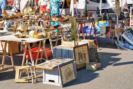 Ascona, Switzerland - August 23, 2016: Various goods for selling at the counter in the flea street market in Ascona, Lake Maggiore, Ticino canton, Switzerland.のeditorial素材