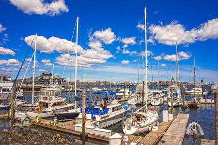 Pier of Boston Wharf with sailboats in Charles River,  Boston, Massachusetts, the United States.の写真素材