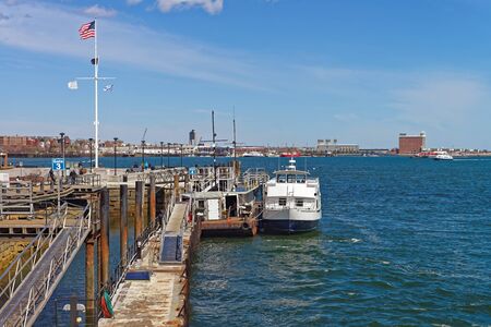 Pier of Boston Wharf with sailboat and Charles River,  Boston, Massachusetts, the United States.の写真素材