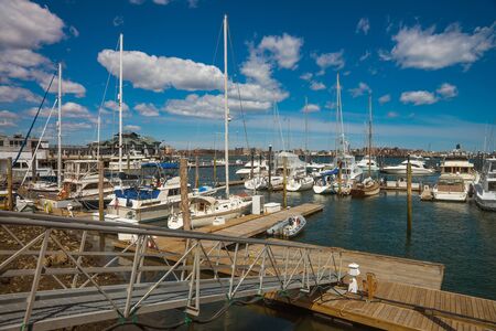 Pier of Long Wharf with Customhouse Block and sailboats in Charles River in Boston, Massachusetts, USA.の写真素材
