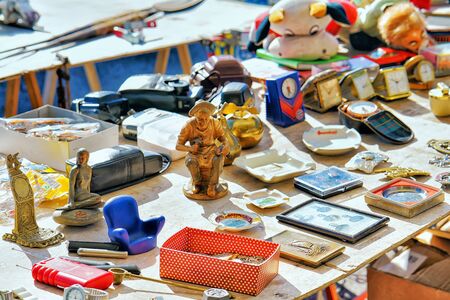 Ascona, Switzerland - August 23, 2016: Various goods for selling at the counter in the flea street market, Ascona, Lake Maggiore, Ticino canton, Switzerland.のeditorial素材