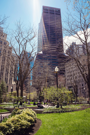Boston, USA - April 28, 2015: Post Office Square and Skyline with Skyscrapers, downtown Boston, MA, USA. People on the background. With special sun flare and rays of lightのeditorial素材