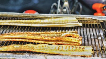 Fried fish at Myeongdong open street market in Seoul, South Korea. Selective focusの写真素材