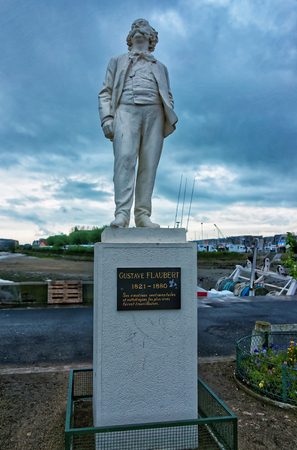 Trouville, France - May 9, 2012: Gustave Flaubert statue at the embankment of Touques river in Trouville-sur-Mer, or Trouville in Calvados department of Normandy region, France.のeditorial素材