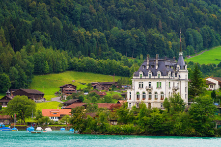 Mansion on Lake Brienz and Brienzer Rothorn mountain at Interlaken in Canton of Bern in Switzerlandのeditorial素材