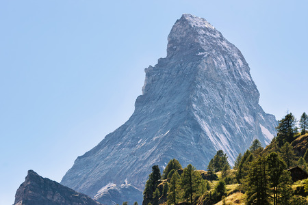 Matterhorn mountain and green forest on the hill, Zermatt, in Switzerland in summer.の写真素材