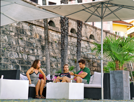 Ascona, Switzerland - August 23, 2016: People in Street Restaurant at Ascona town on Lake Maggiore in Ticino canton of Switzerland.のeditorial素材