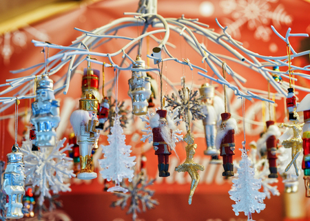 Xmas tree wooden decorations as gift souvenirs at one of the many stalls at the Christmas Market in...