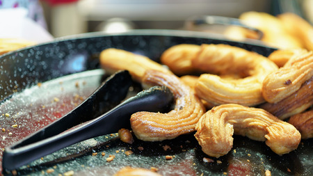 Delicious homemade churros photographed at one of the stalls on the Christmas Market in Vilnius, Lithuania.の写真素材