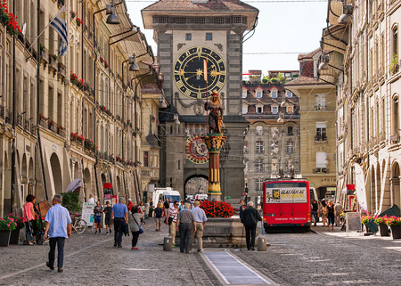 Bern, Switzerland - August 31, 2016: People at Zahringen fountain and Zytglogge clock tower on Kramgasse street with shopping area in old city center of Bern, Switzerlandのeditorial素材
