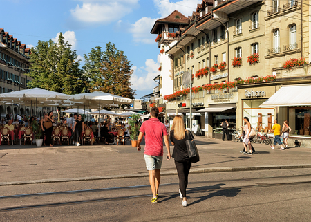 Bern, Switzerland - August 31, 2016: People at Marktgasse street with open air cafes in old city center of Bern, Switzerlandのeditorial素材