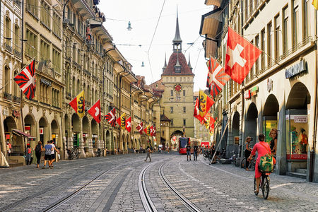 Bern, Switzerland - August 31, 2016: People at Kafigturm tower in Marktgasse street with shopping area in old city center of Bern, Switzerlandのeditorial素材