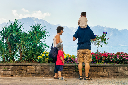 Montreux, Switzerland - August 27, 2016: Family with mother, father and children at the embankment of Geneva Lake in Montreux, Vaud canton, Switzerlandのeditorial素材