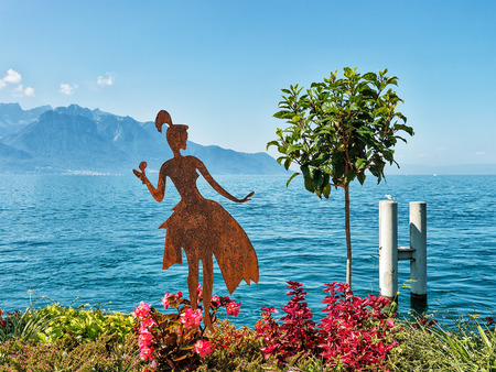 Montreux, Switzerland - August 27, 2016: Figure of a woman on promenade of Geneva Lake in Montreux, Vaud canton, Switzerlandのeditorial素材