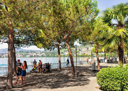 Montreux, Switzerland - August 27, 2016: People walking at the promenade on Geneva Lake in Montreux, Vaud canton, Switzerlandのeditorial素材