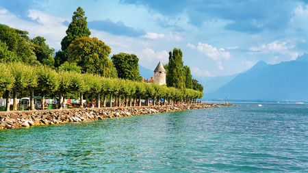 Vevey, Switzerland - August 27, 2016: Promenade with Alps mountains and Geneva Lake Riviera in Vevey, Vaud canton, Switzerland. People on the backgroundのeditorial素材