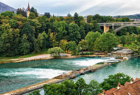 Dam on Aare River, Kirchenfeld bridge and Historical Museum in Bern, Switzerland. Seen from Bundesterrasseの写真素材