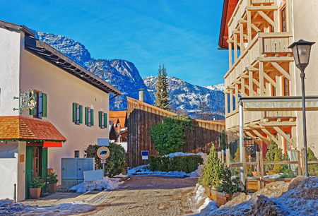 Street in Bavarian style with Alps in winter Garmisch Partenkirchen old town, Germany.の写真素材