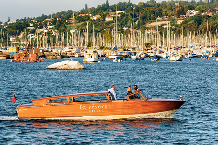 Geneva, Switzerland - August 30, 2016: Boat with people on Geneva Lake near Promenade du Lac in summer, Geneva, Switzerland.のeditorial素材