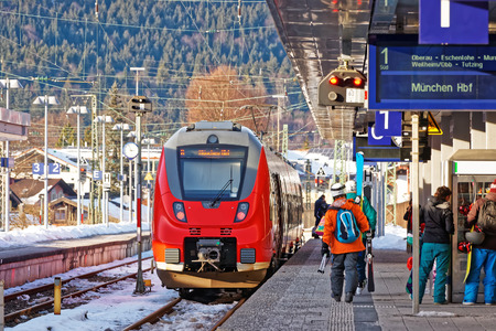 Garmisch-Partenkirchen, Germany - January 6, 2015: Passengers and high speed train at the railway train station, Garmisch-Partenkirchen, Germany.のeditorial素材