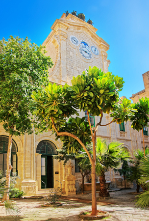 Valletta, Malta - April 1, 2014: Clock tower at Prince Alfred Courtyard at Grandmaster palace of Valletta, Maltaのeditorial素材