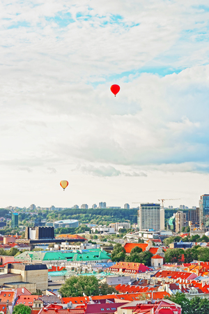 Financial district in Vilnius and hot air balloons in the sky, Lithuaniaの写真素材