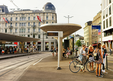 Zurich, Switzerland - September 2, 2016: People at Bellevue bus stop in Zurich city center, Switzerland.のeditorial素材