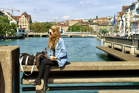 Zurich, Switzerland - September 2, 2016: Girl relaxing at Limmatquai in Zurich, Switzerlandのeditorial素材