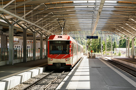 Concourse and train at Railway train station in Zermatt, Visp, Switzerland.