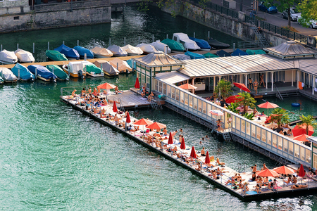 Zurich, Switzerland - September 2, 2016: Women beach at Limmat River quay in the city center in Zurich, Switzerlandのeditorial素材