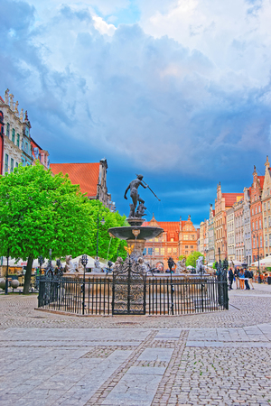 Gdansk, Poland - May 7, 2014: Neptune Statue on Long Market Square in the old city center in Gdansk, Poland. People on the backgroundのeditorial素材