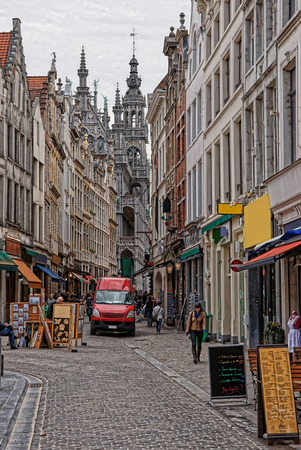 Brussels, Belgium - May 11, 2012: Street in the old city center with tourists and a view on Town Hall, Brussels, capital of Belgium.のeditorial素材