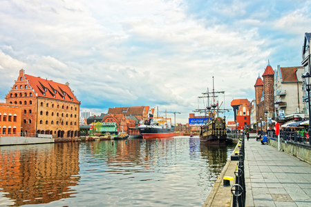 Gdansk, Poland - May 7, 2014: Old Ships at Waterfront of Motlawa River in Gdansk, Poland. People on...