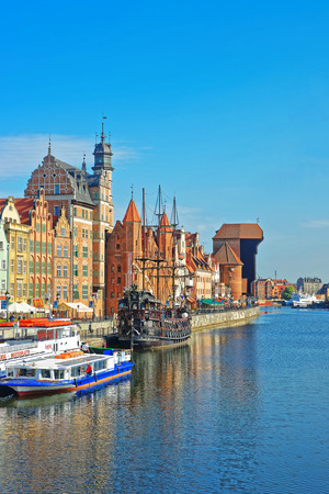 Gdansk, Poland - May 8, 2014: Ferry boat and old ship at Waterside of Motlawa River of Gdansk,...