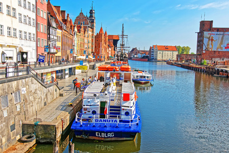 Gdansk, Poland - May 8, 2014: Ferry at Waterfront of Motlawa River, Gdansk, Poland. People on the...