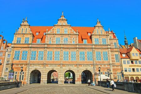 Gdansk, Poland - May 8, 2014: Green gate on Long Market Square of Gdansk, Poland. People on the...