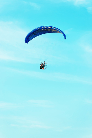 Paraglider flying over with the parachute in Polandの写真素材